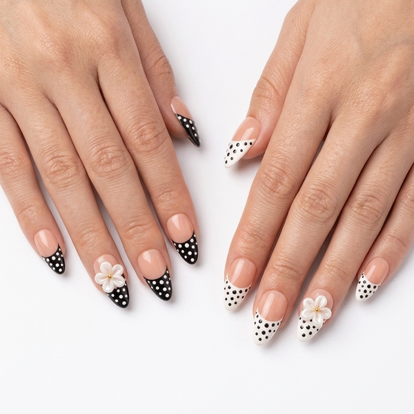 Close-up of hands with decorative nail art on a white background