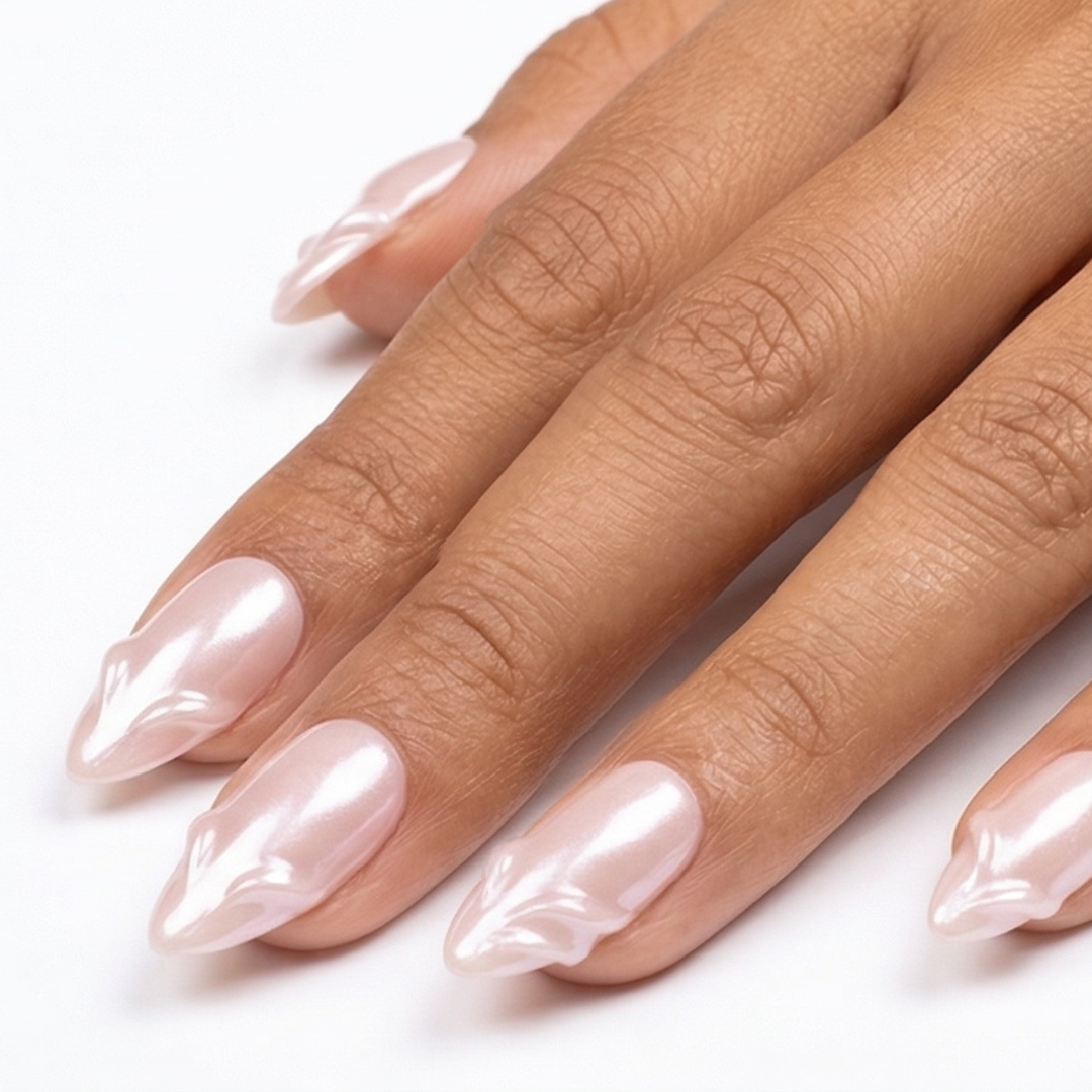Hand with pink nail polish on a white background