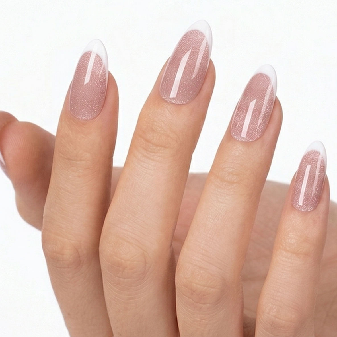 Close-up of a hand with pink nail polish on a white background