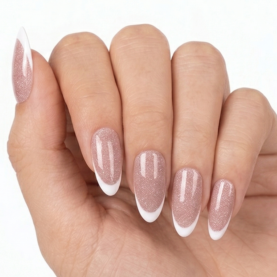 Hand with long, clear nail polish on a white background